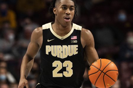 Purdue Boilermakers guard Jaden Ivey brings the ball up the court in a Big Ten basketball game against the Minnesota Golden Gophers