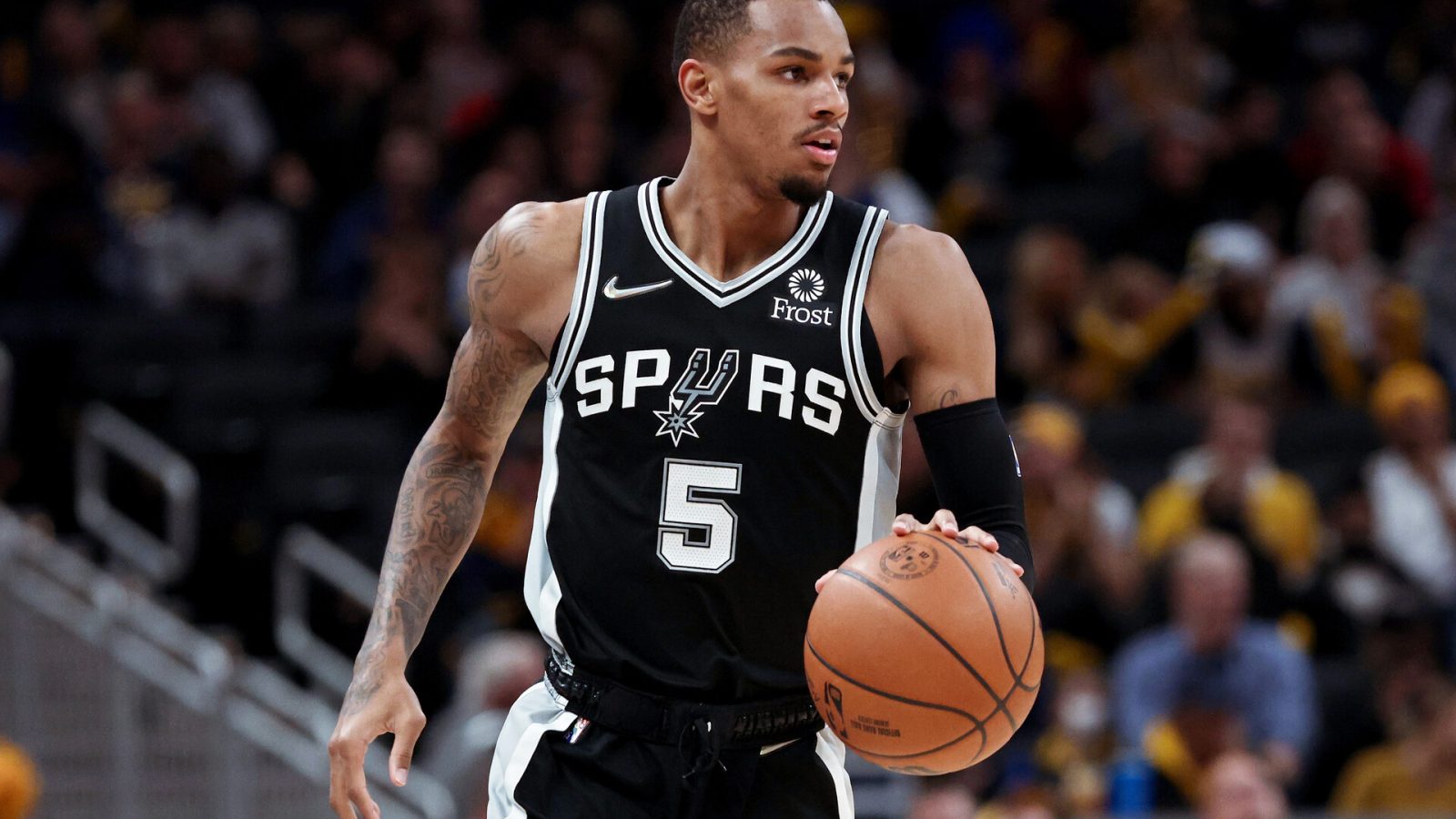 Dejounte Murray #5 of the San Antonio Spurs dribbles the ball in the second quarter against the Indiana Pacers at Gainbridge Fieldhouse on November 01, 2021 in Indianapolis, Indiana.