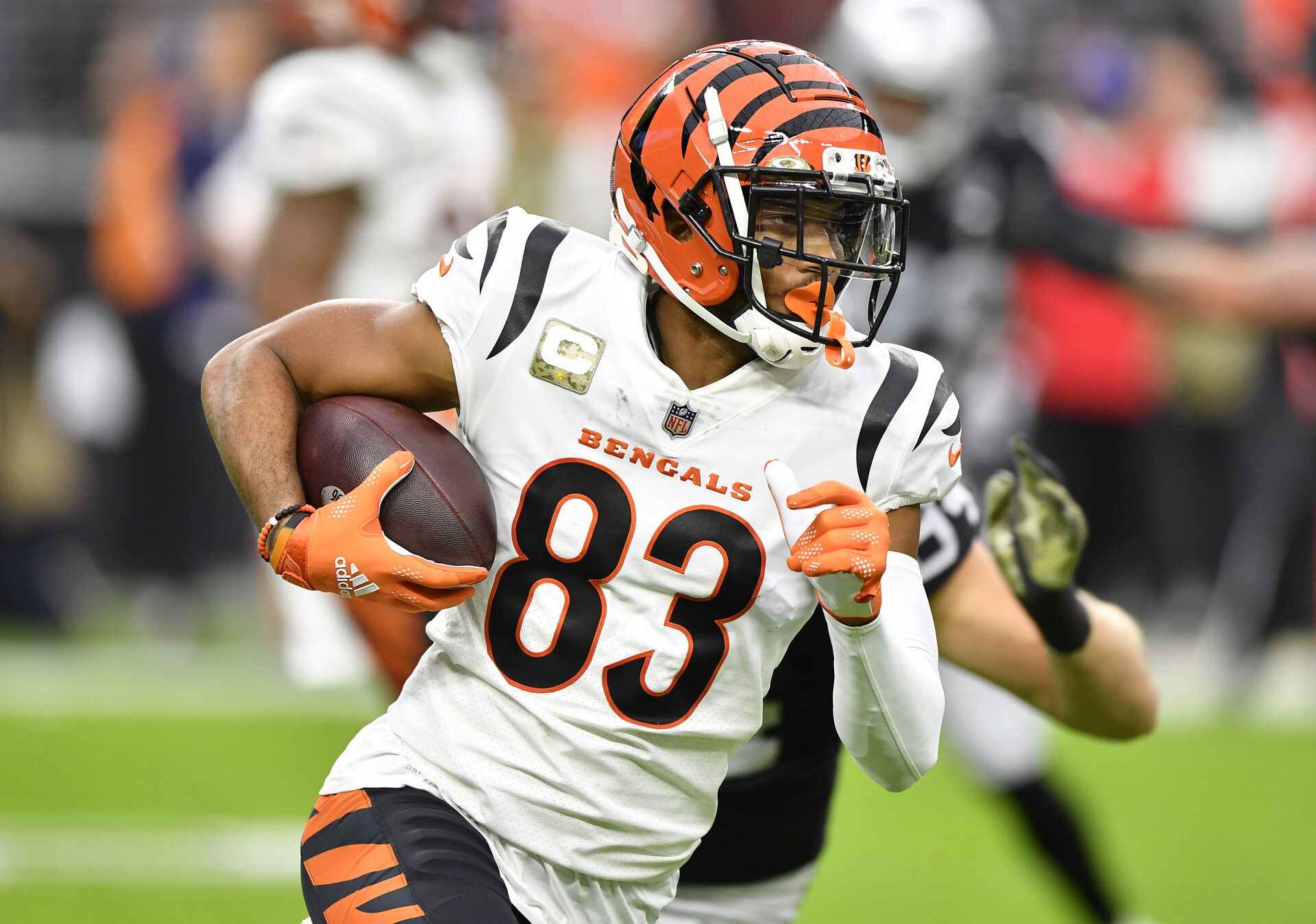 Tyler Boyd #83 of the Cincinnati Bengals runs the ball during the first quarter in the game against the Las Vegas Raiders at Allegiant Stadium on November 21, 2021 in Las Vegas, Nevada.