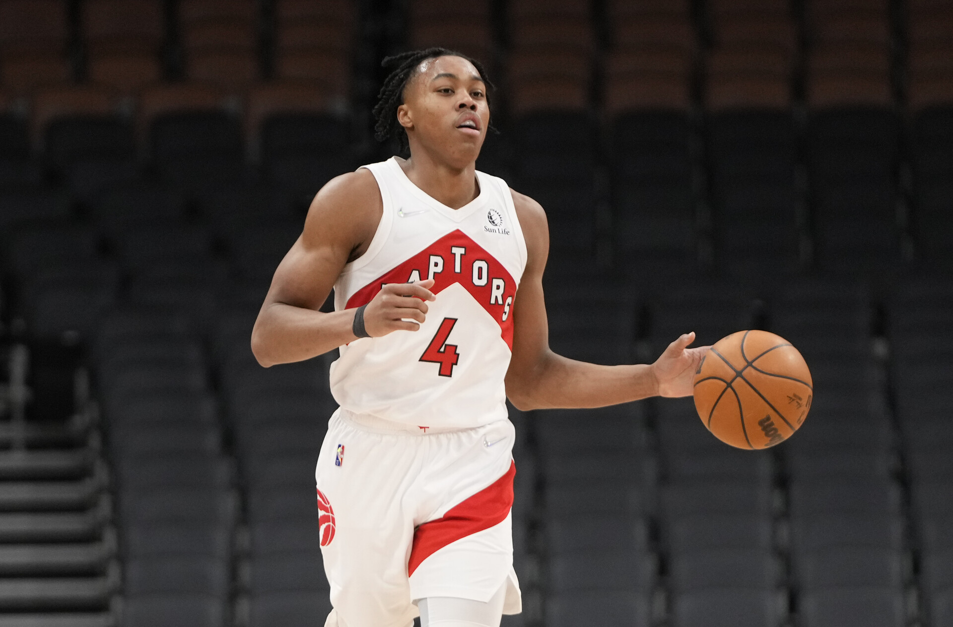 Scottie Barnes #4 of the Toronto Raptors dribbles against the San Antonio Spurs during the second half of their basketball game at the Scotiabank Arena on January 4, 2022 in Toronto, Ontario, Canada.