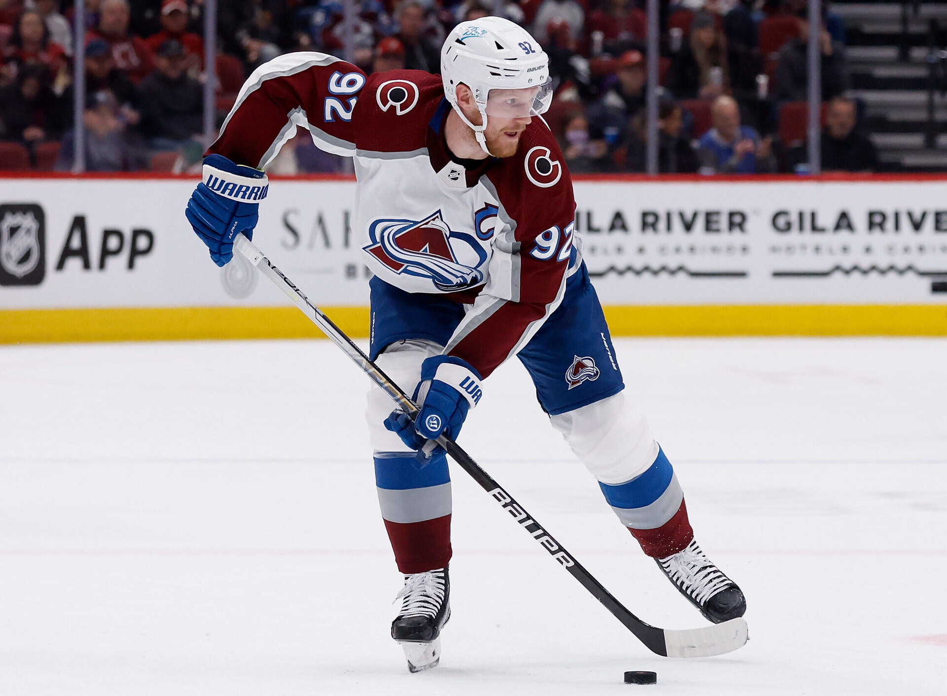 Gabriel Landeskog #92 of the Colorado Avalanche skates with the puck during the NHL game at Gila River Arena on January 15, 2022 in Glendale, Arizona.