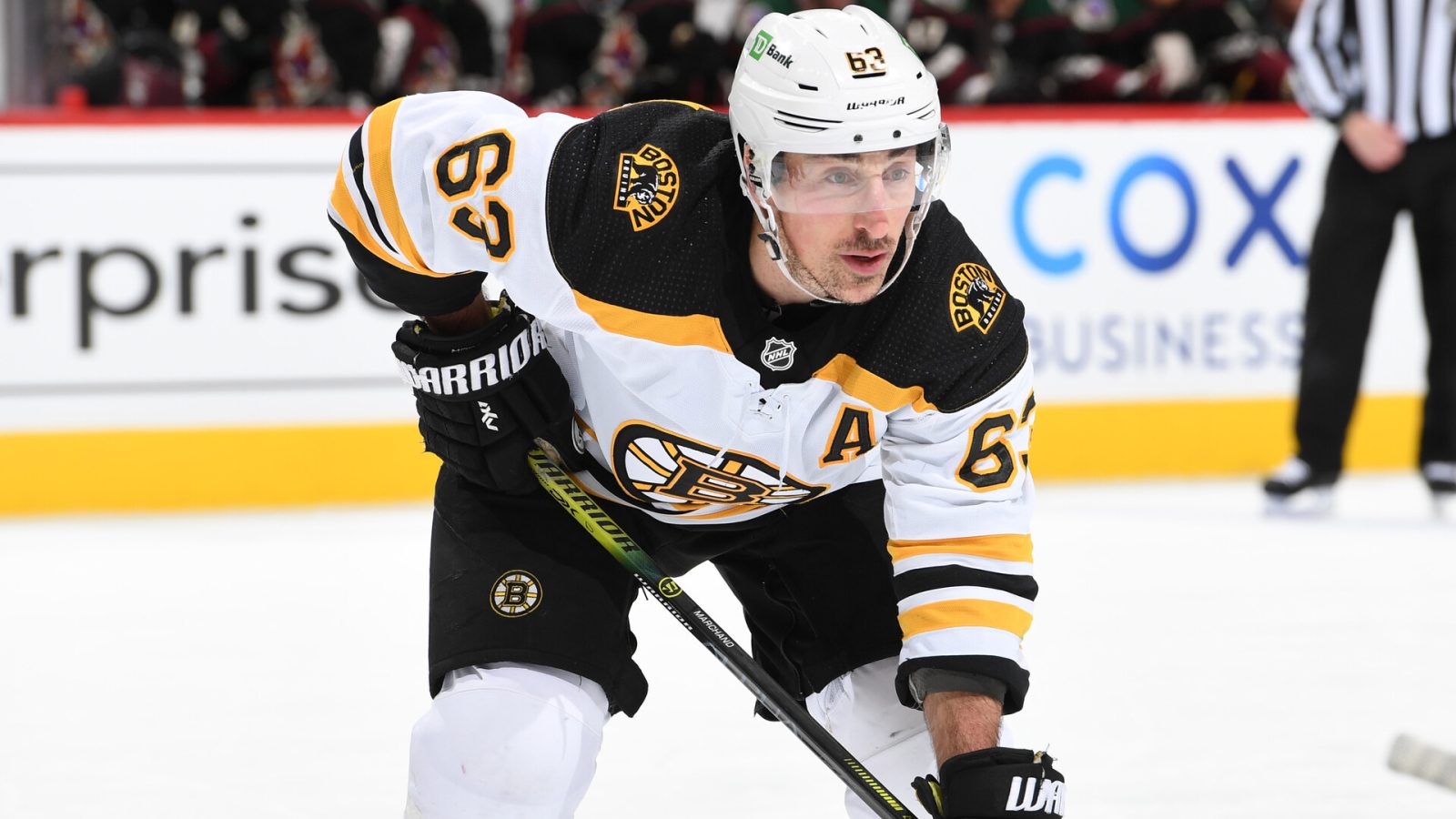 Brad Marchand #63 of the Boston Bruins gets ready during a face off against the Arizona Coyotes at Gila River Arena on January 28, 2022 in Glendale, Arizona.