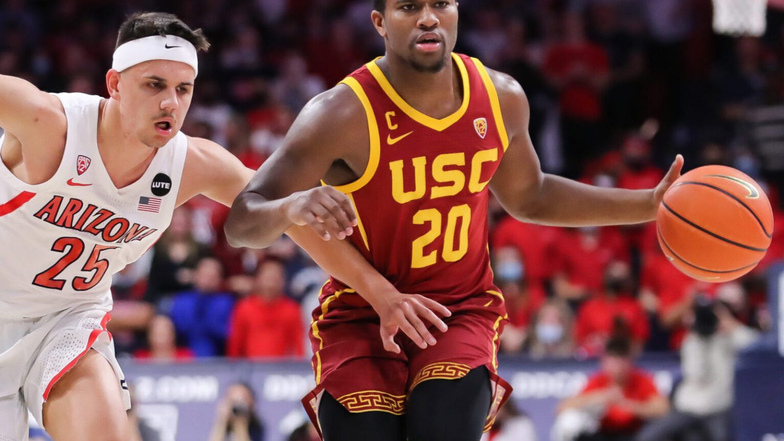 Arizona Wildcats guard Kerr Kriisa (left) defends USC guard Ethan Anderson (right) during a Pac-12 basketball game