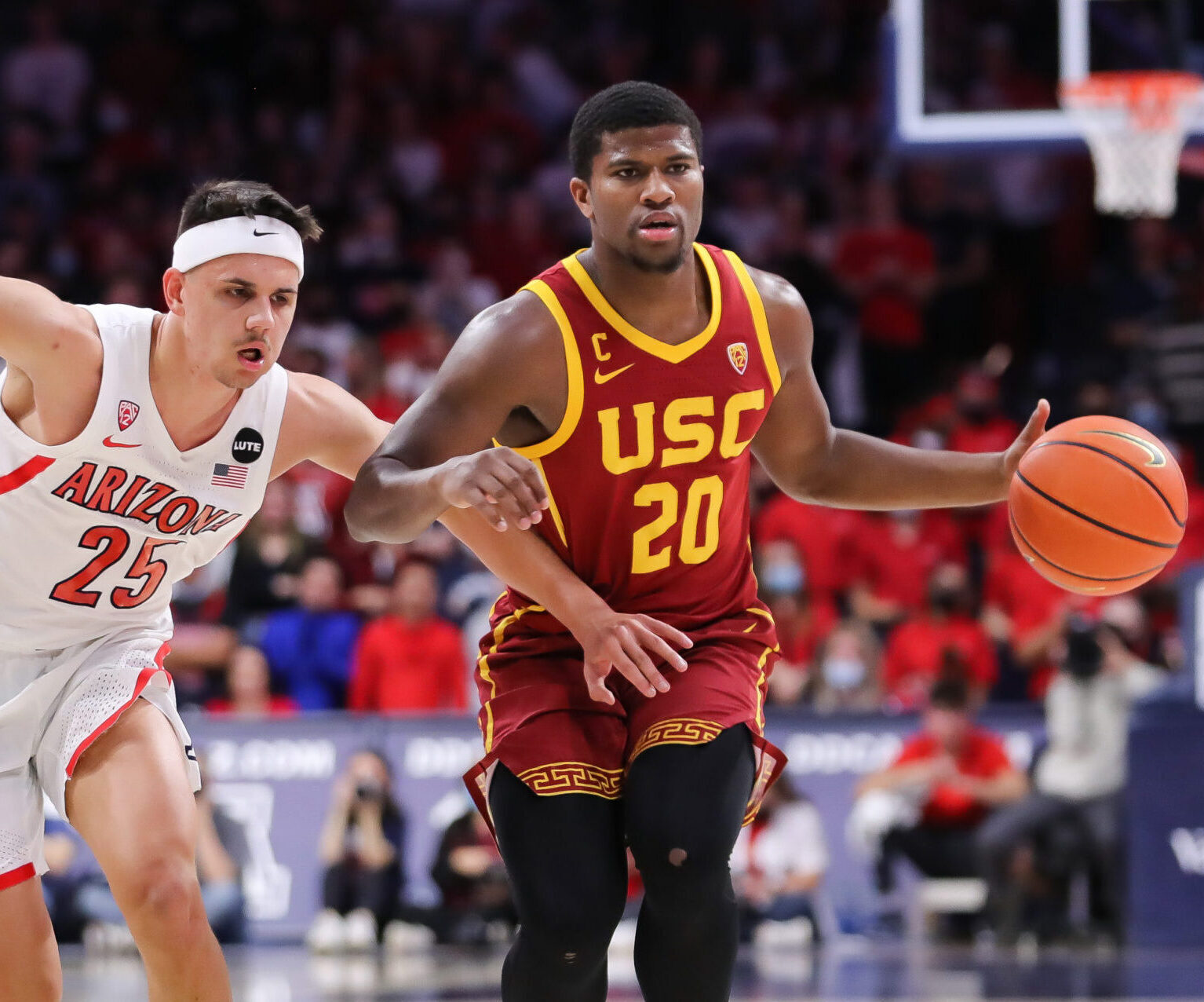 Arizona Wildcats guard Kerr Kriisa (left) defends USC guard Ethan Anderson (right) during a Pac-12 basketball game