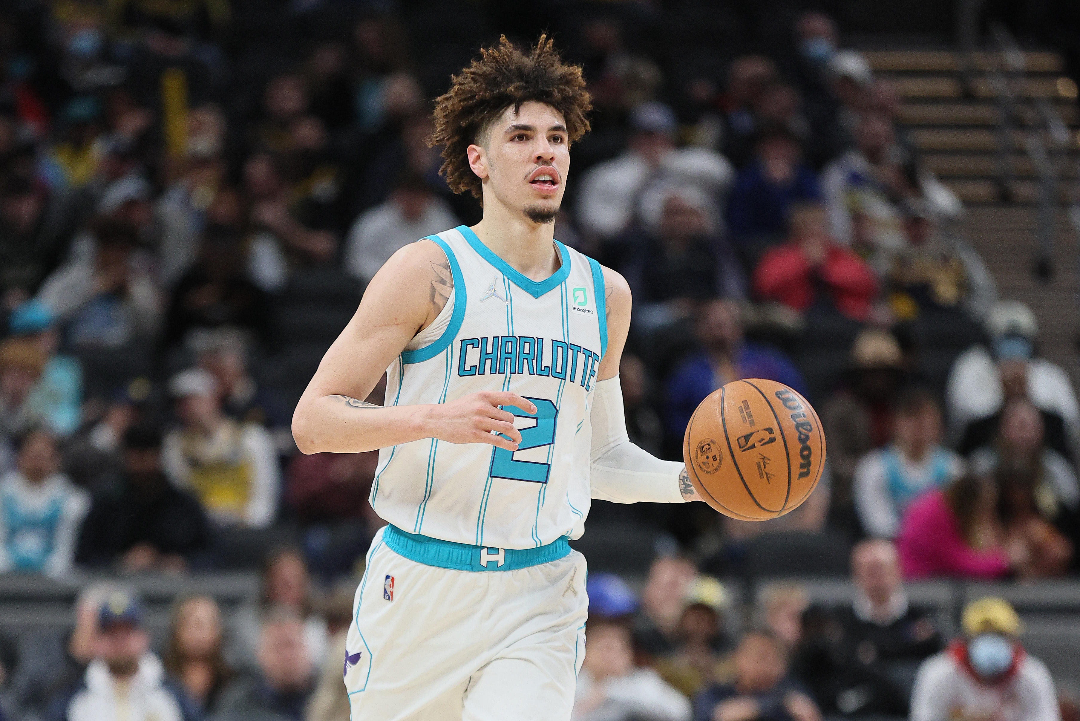 Charlotte Hornets guard LaMelo Ball dribbles the basketball upcourt against the Indiana Pacers