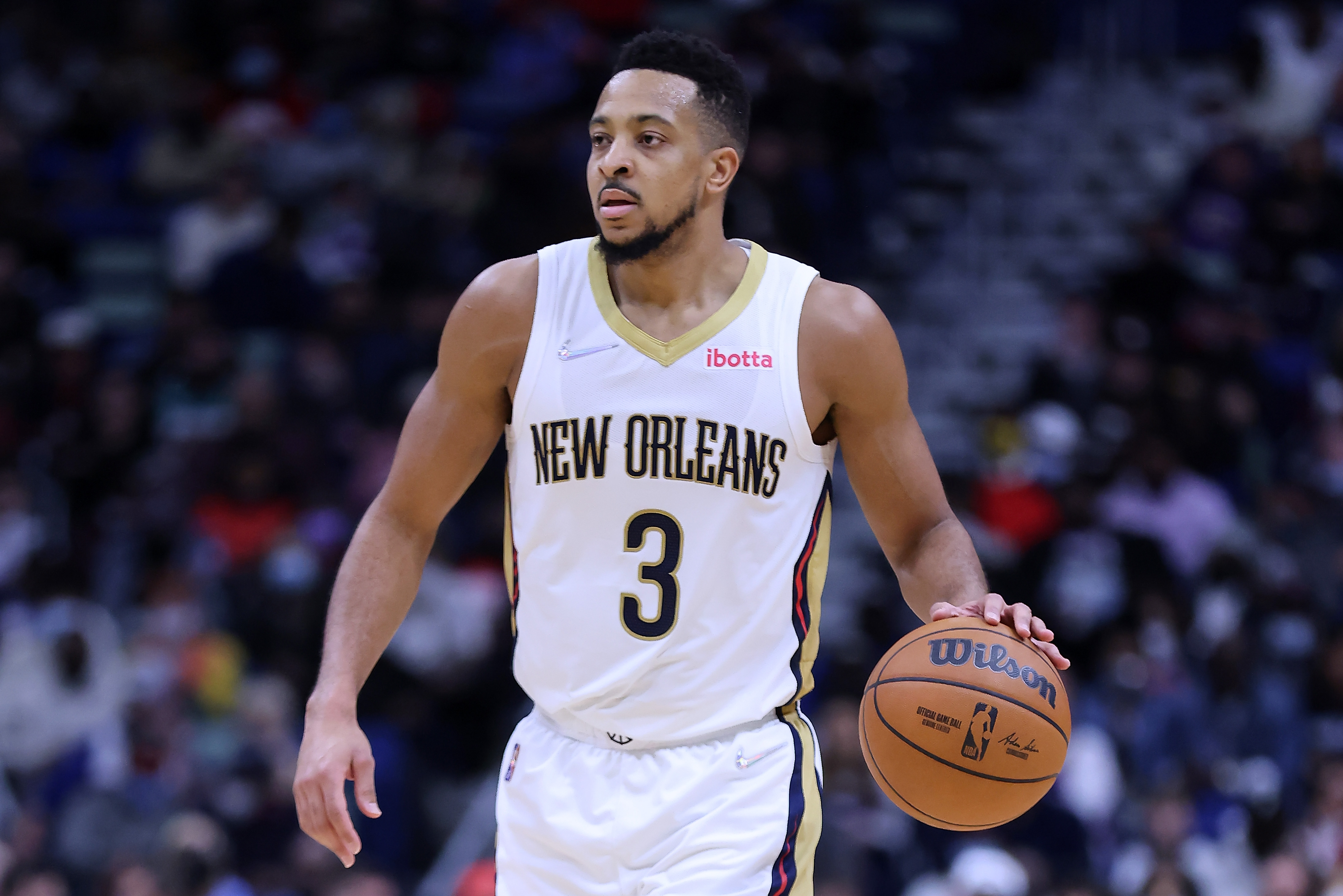 New Orleans Pelicans guard C.J. McCollum dribbles the basketball upcourt during a game against the Memphis Grizzlies