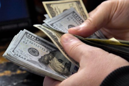 A bettor pays for wagers on some of the more than 400 proposition bets for Super Bowl LI between the Atlanta Falcons and the New England Patriots at the SuperBook at the Westgate Las Vegas
