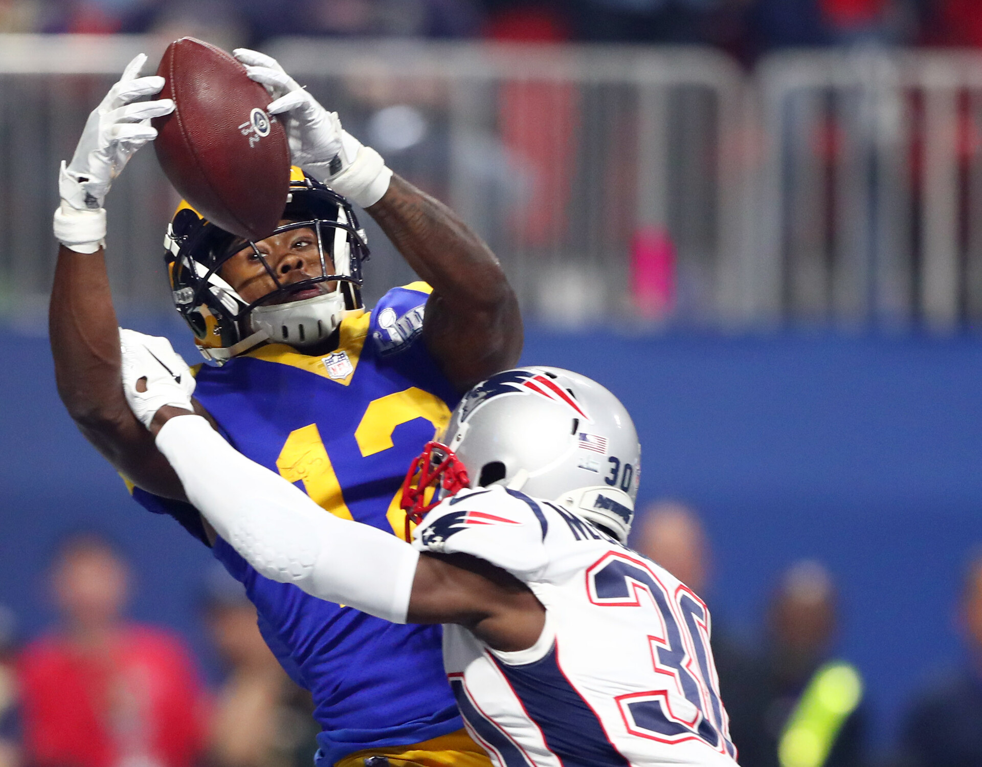 New England Patriots cornerback Jason McCourty (right) breaks up a pass in the end zone intended for Los Angeles Rams wide receiver Brandin Cooks (left) in the third quarter in Super Bowl LIII 
