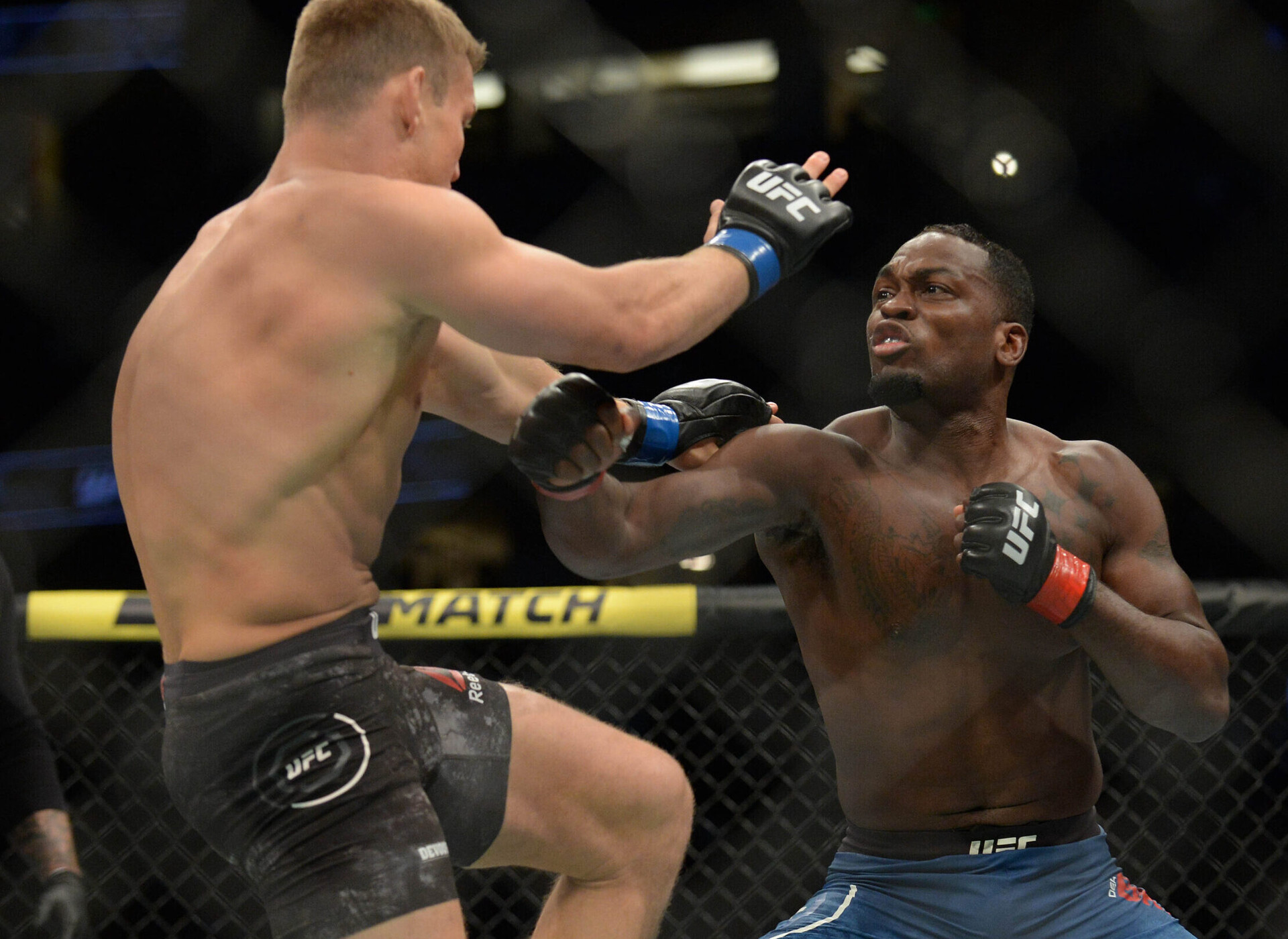 August 17, 2019; Anaheim, CA, USA; Derek Brunson moves in with a hit against Ian Heinisch during UFC 241 at Honda Center.