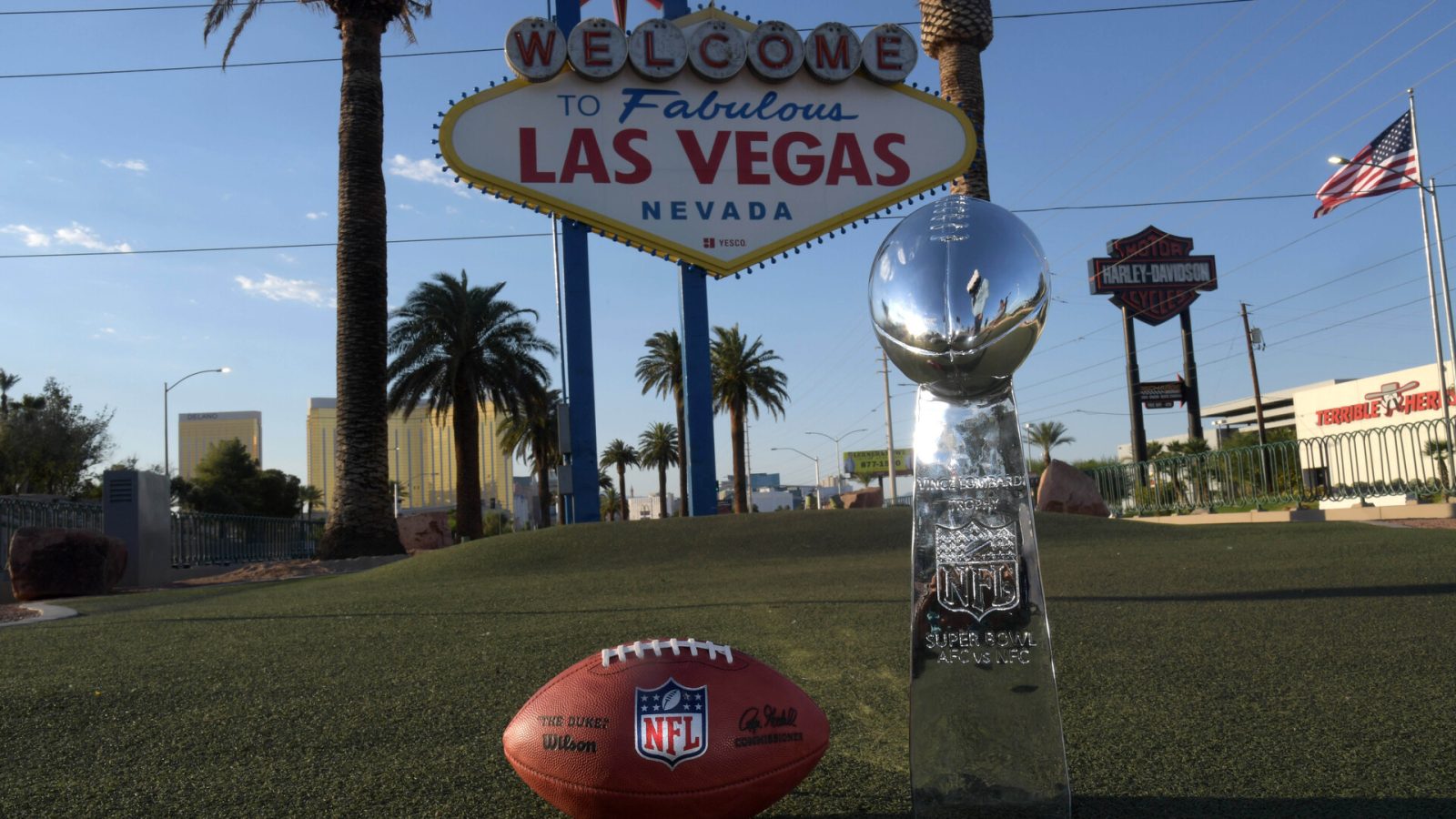 May 29, 2020; Las Vegas, Nevada, USA; A Wilson 2020 NFL ÒThe DukeÓ official football and Super Bowl Vince Lombardi trophy at the Welcome to Fabulous Las Vegas sign on the Las Vegas strip.