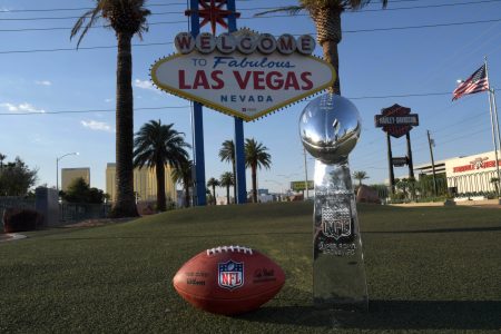 May 29, 2020; Las Vegas, Nevada, USA; A Wilson 2020 NFL ÒThe DukeÓ official football and Super Bowl Vince Lombardi trophy at the Welcome to Fabulous Las Vegas sign on the Las Vegas strip.