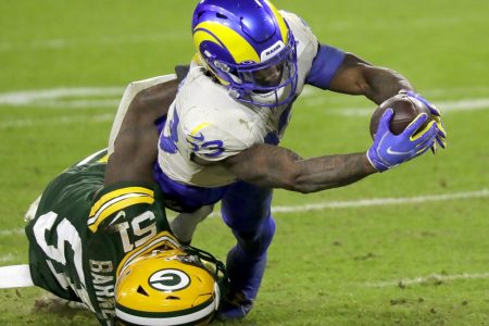 Los Angeles Rams running back Cam Akers (23) dives across the goal line against Green Bay Packers inside linebacker Krys Barnes (51) during their divisional playoff game on Saturday, January 16, 2021, at Lambeau Field in Green Bay, Wis. Apc Pack Vs Rams Div Playoff 2427 011621 Wag