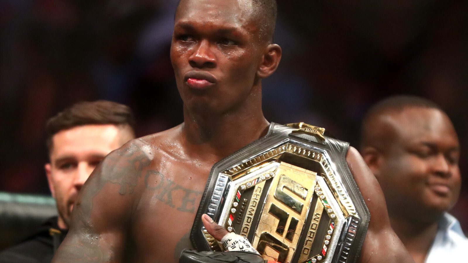 Jun 12, 2021; Glendale, Arizona, USA; Israel Adesanya celebrates with the championship belt during UFC 263 at Gila River Arena.