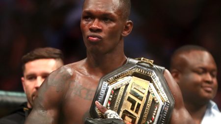 Jun 12, 2021; Glendale, Arizona, USA; Israel Adesanya celebrates with the championship belt during UFC 263 at Gila River Arena.