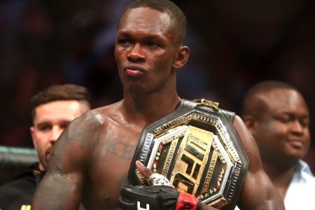 Jun 12, 2021; Glendale, Arizona, USA; Israel Adesanya celebrates with the championship belt during UFC 263 at Gila River Arena.