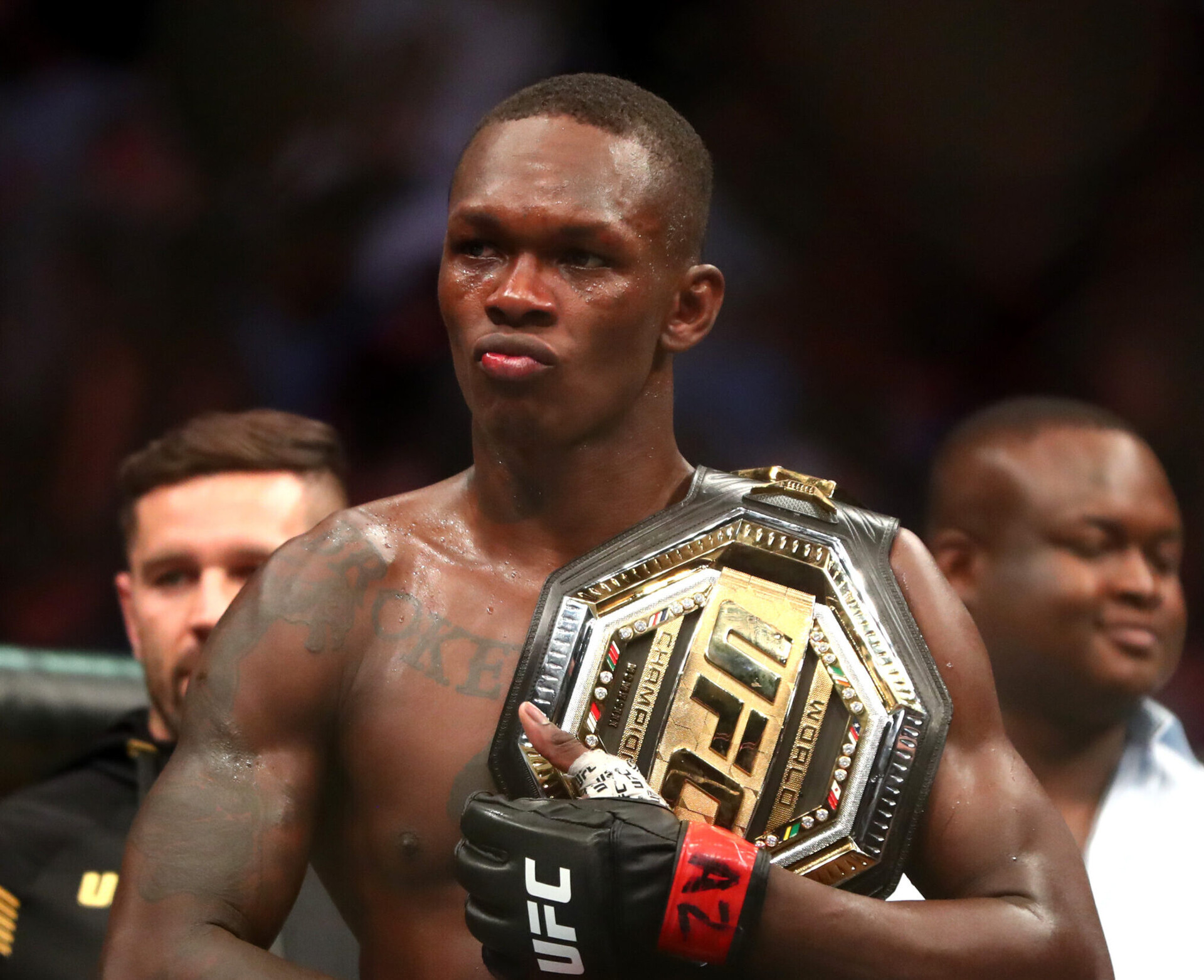 Jun 12, 2021; Glendale, Arizona, USA; Israel Adesanya celebrates with the championship belt during UFC 263 at Gila River Arena.