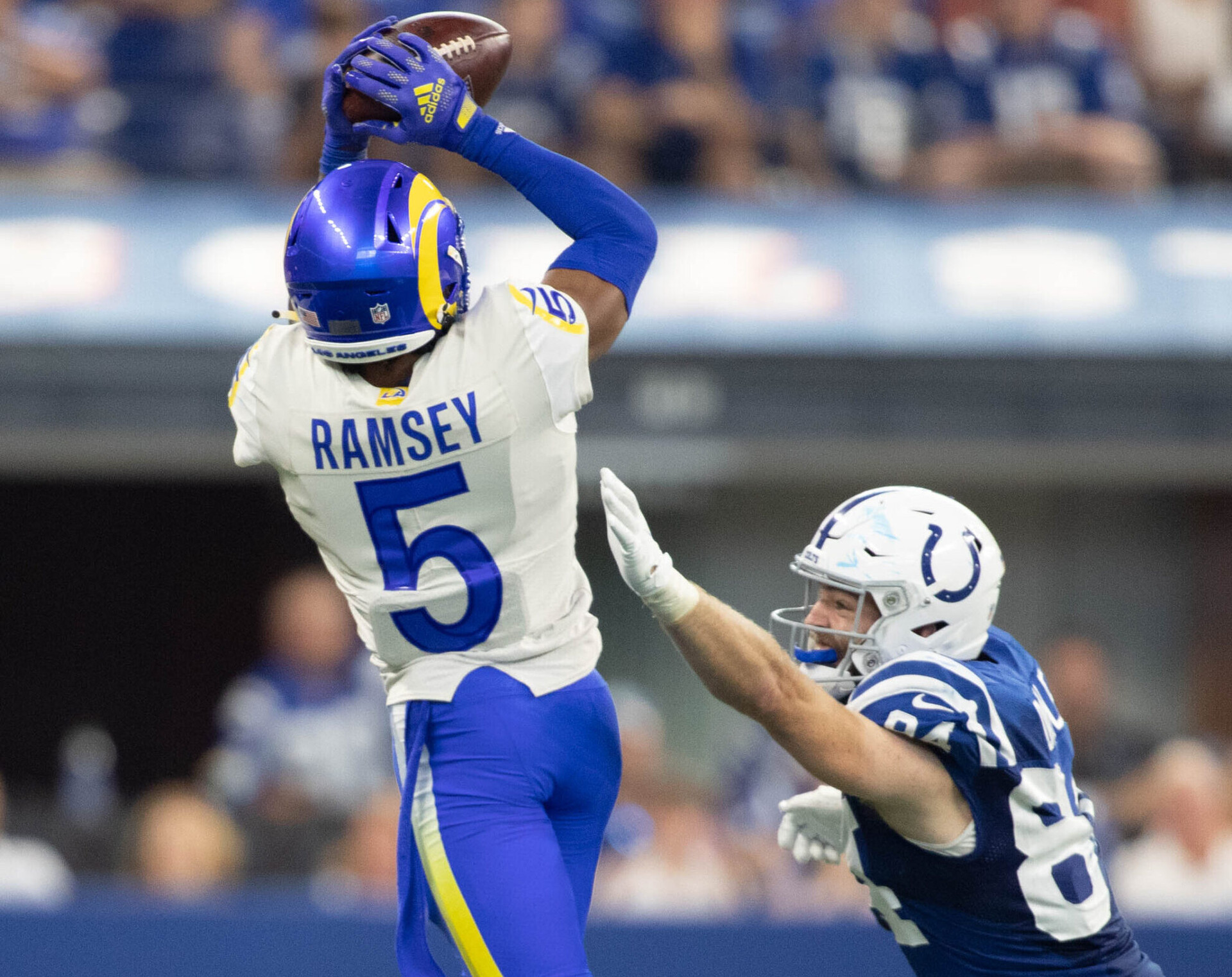 Los Angeles Rams cornerback Jalen Ramsey (5) intercepts the ball while Indianapolis Colts tight end Jack Doyle (right) defends