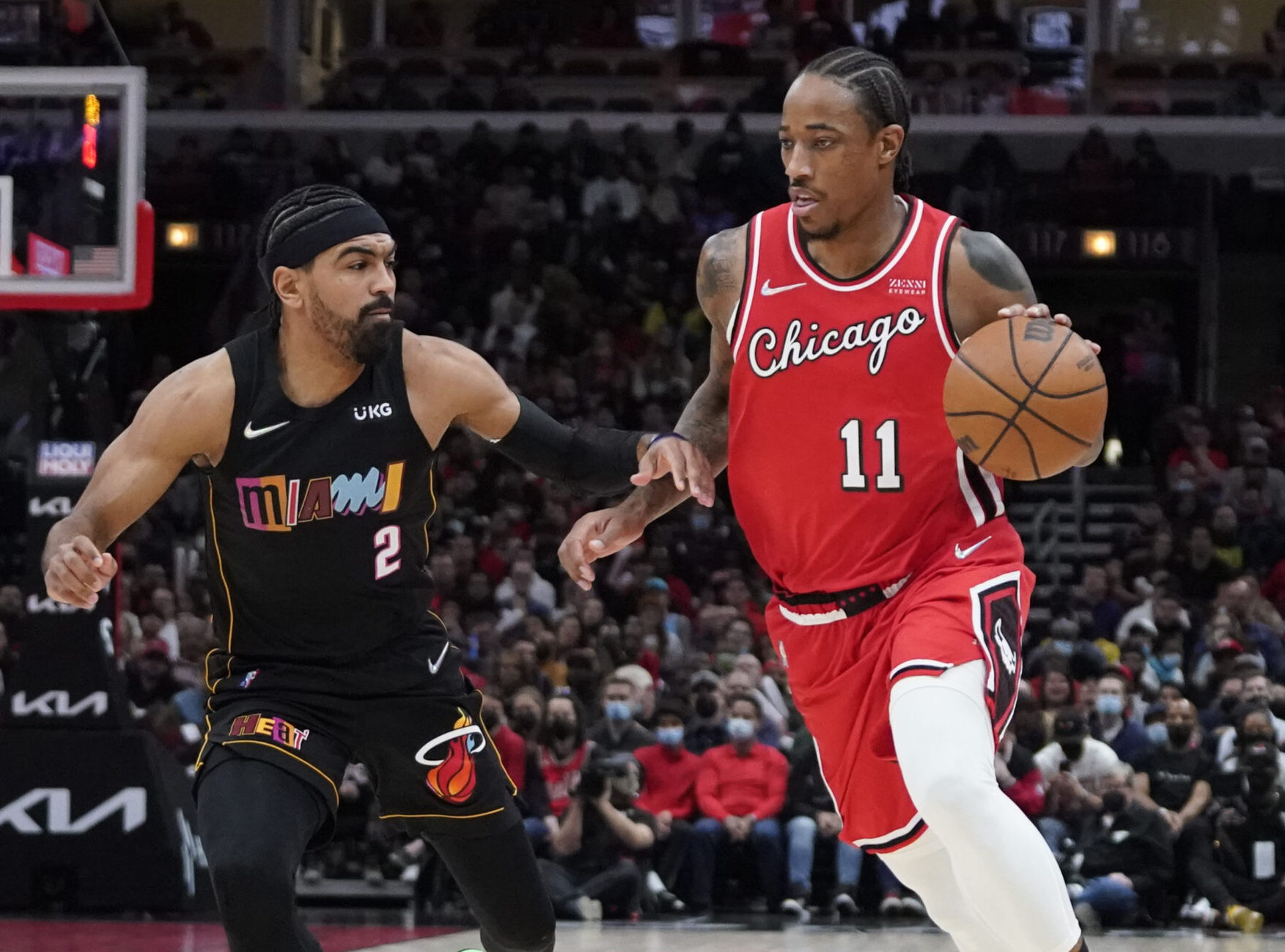 Miami Heat guard Gabe Vincent (left) defends Chicago Bulls forward DeMar DeRozan (right)