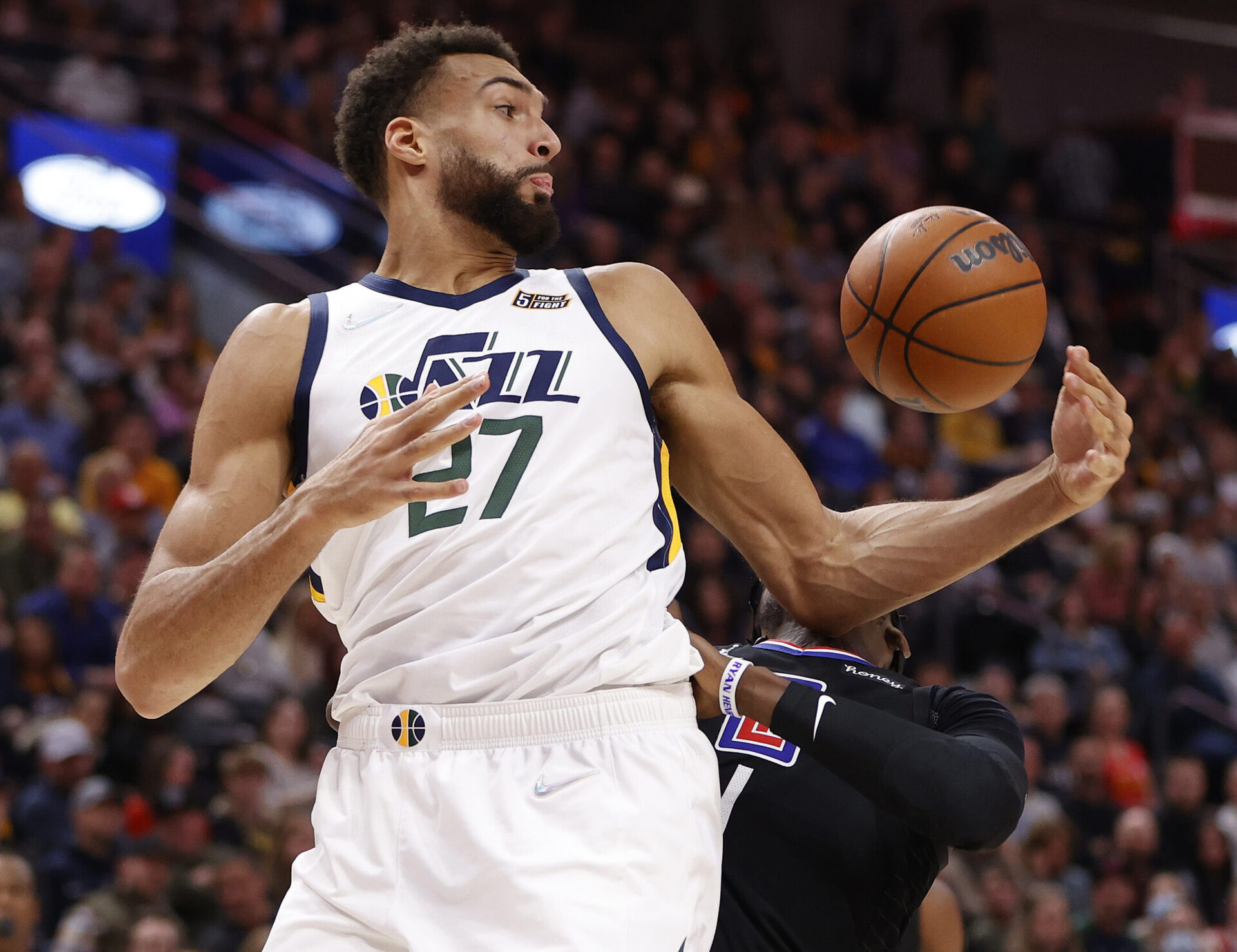 Utah Jazz center Rudy Gobert (27) grabs a rebound in front of Los Angeles Clippers guard Reggie Jackson