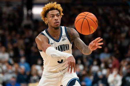 Villanova Wildcats guard Justin Moore passes the ball against the Creighton Bluejays