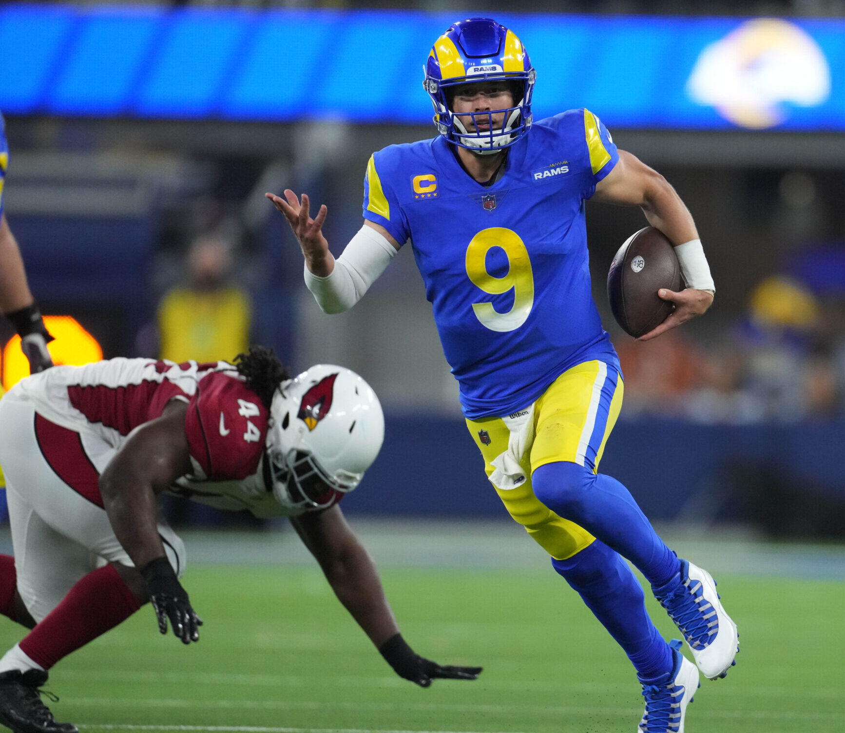 Los Angeles Rams quarterback Matthew Stafford carries the ball during an NFC Wild Card game against the Arizona Cardinals