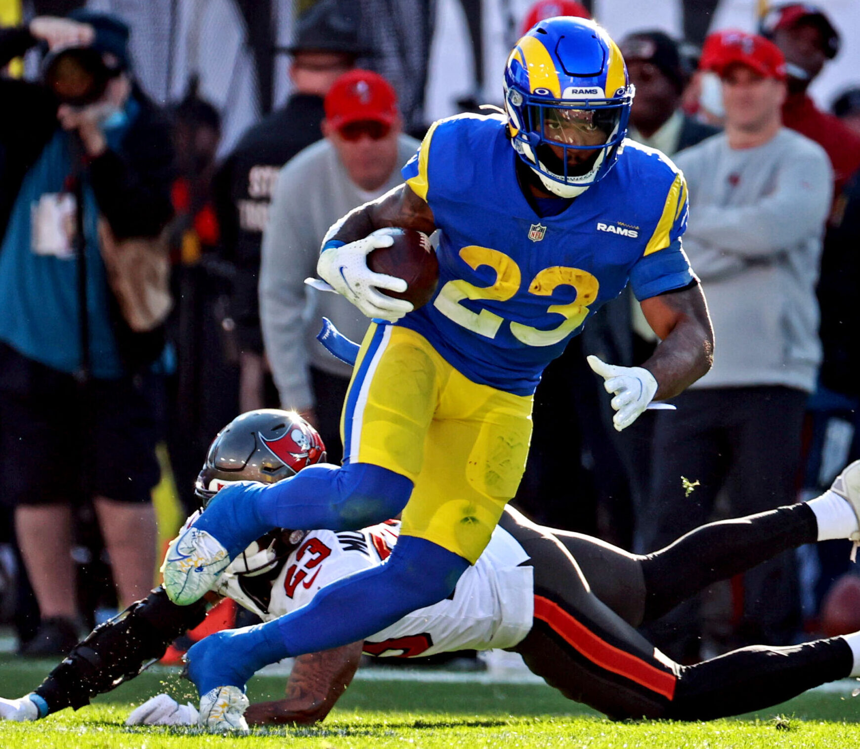 Los Angeles Rams running back Cam Akers (23) runs the ball against Tampa Bay Buccaneers cornerback Sean Murphy-Bunting (23) during the first half in a NFC Divisional playoff football game