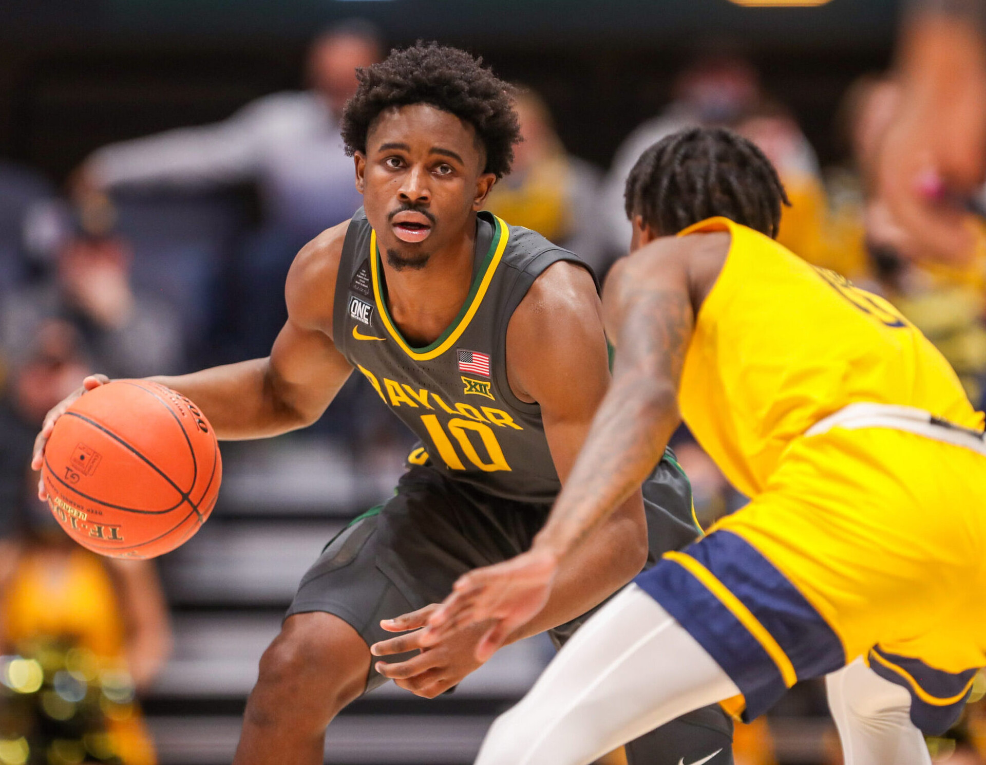 Baylor Bears guard Adam Flagler dribbles the ball against the West Virginia Mountaineers