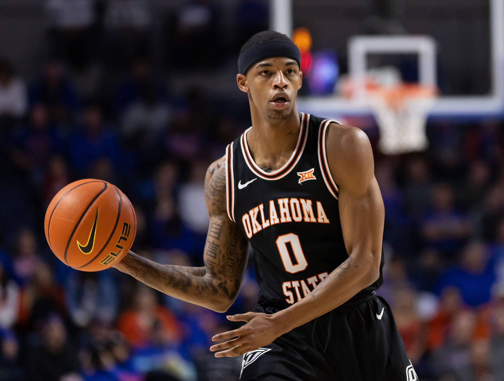 Oklahoma State Cowboys guard Avery Anderson III looks to pass during a Big 12 basketball game against the Florida Gators
