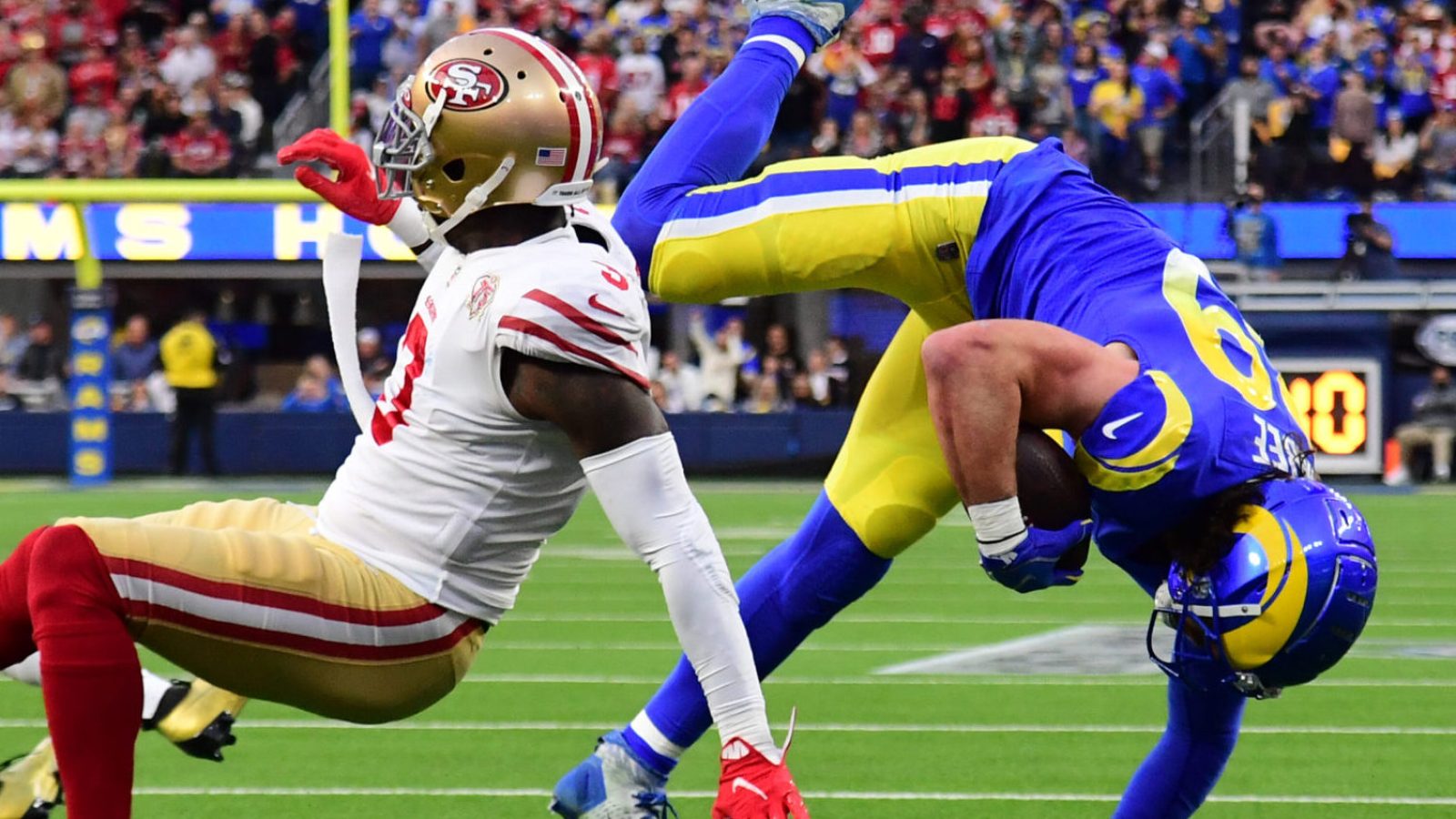 Jan 30, 2022; Inglewood, California, USA; Los Angeles Rams tight end Tyler Higbee (89) is tackled by San Francisco 49ers safety Jaquiski Tartt (3) in the first half during the NFC Championship Game at SoFi Stadium.