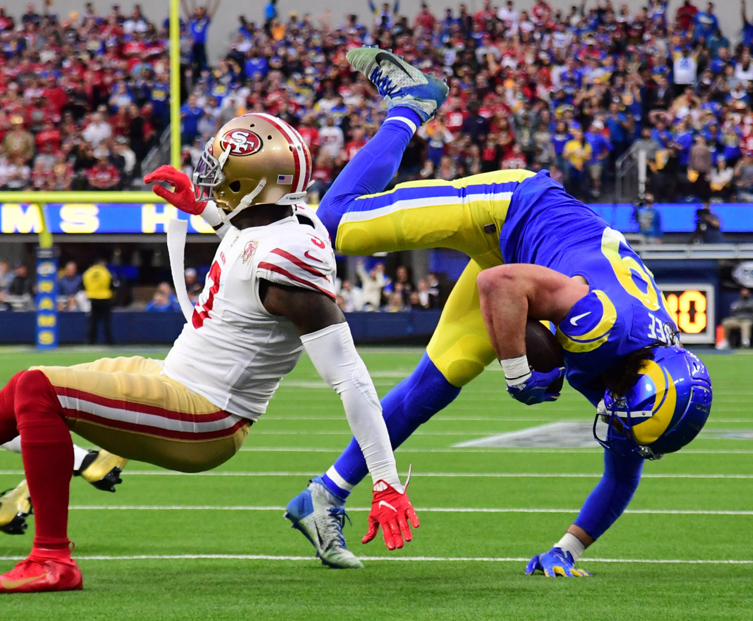 Jan 30, 2022; Inglewood, California, USA; Los Angeles Rams tight end Tyler Higbee (89) is tackled by San Francisco 49ers safety Jaquiski Tartt (3) in the first half during the NFC Championship Game at SoFi Stadium.