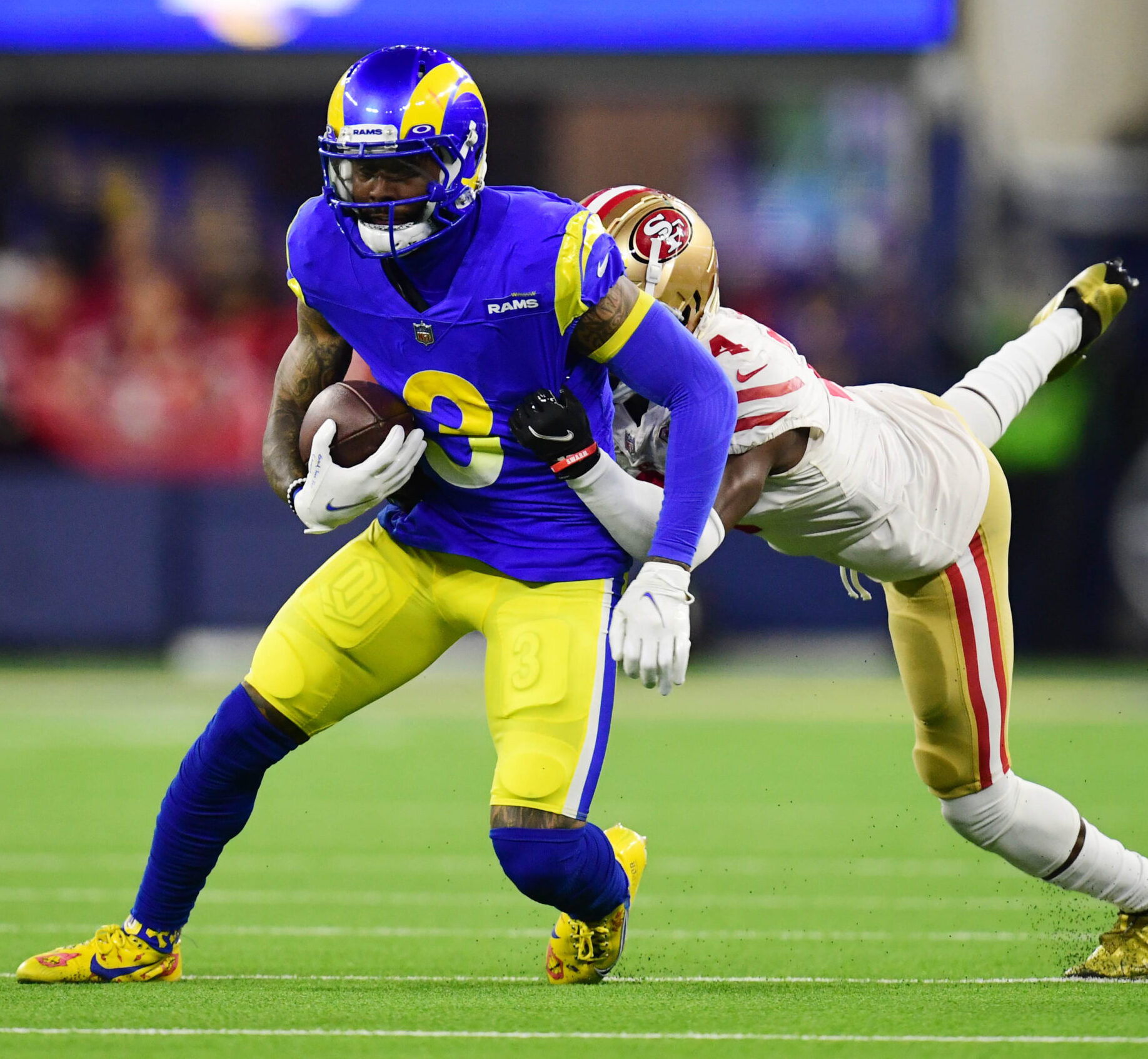 Jan 30, 2022; Inglewood, California, USA; Los Angeles Rams wide receiver Odell Beckham Jr. (3) is tackled by San Francisco 49ers cornerback Emmanuel Moseley (4) in the fourth quarter during the NFC Championship Game at SoFi Stadium.