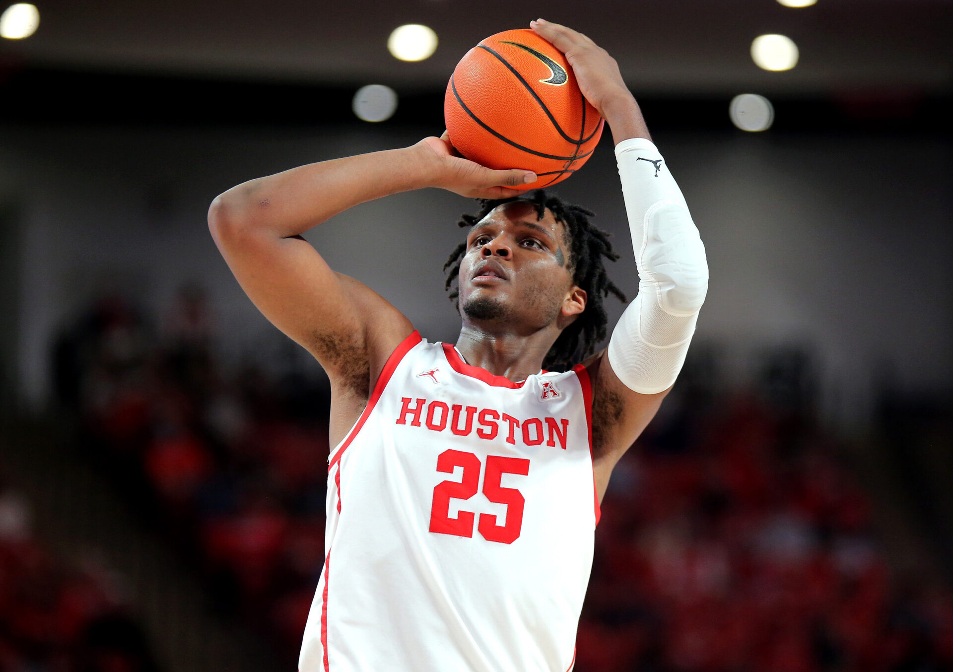 Wednesday College Basketball Betting - Houston Cougars center Josh Carlton shoots a free-throw against the Tulane Green Wave