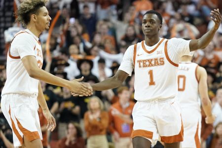 Texas Longhorns guard Andrew Jones (right) congratulated by forward Tre Mitchell (left) after scoring a three-point basket during a Big 12 conference game against the Iowa State Cyclones