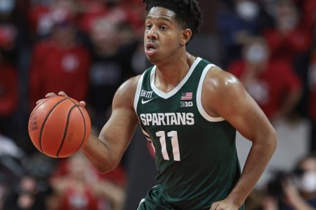 Michigan State Spartans guard A.J. Hoggard dribbles up court against the Rutgers Scarlet Knights during a Big Ten basketball game