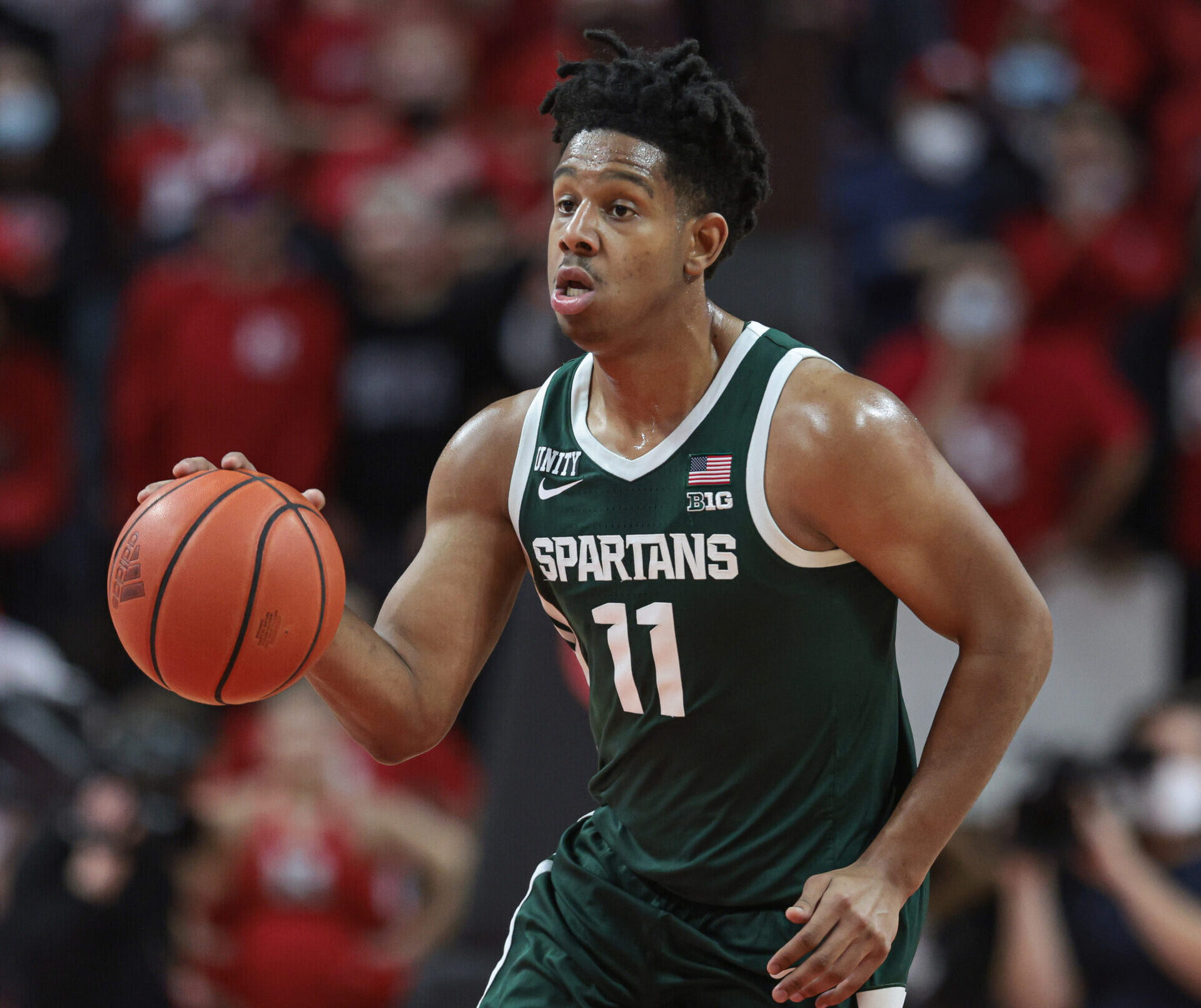 Michigan State Spartans guard A.J. Hoggard dribbles up court against the Rutgers Scarlet Knights during a Big Ten basketball game
