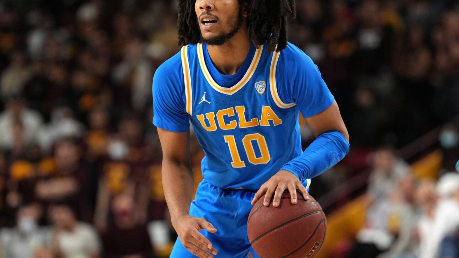 UCLA Bruins guard Tyger Campbell dribbles during a Pac-12 basketball game against the Arizona State Sun Devils