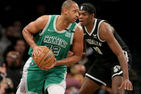 Boston Celtics center Al Horford (left) controls the ball against Brooklyn Nets center Day'Ron Sharpe (right)