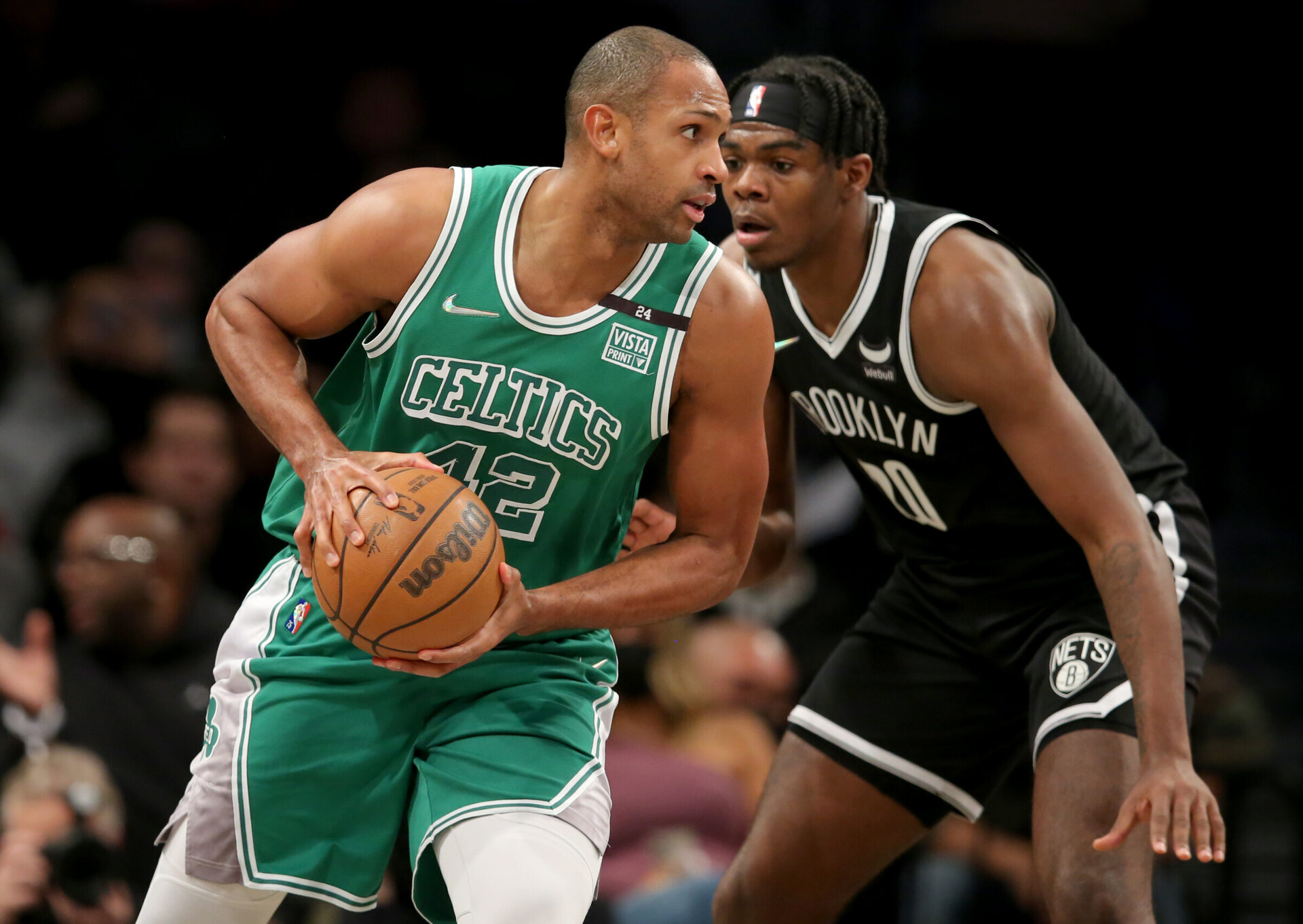Boston Celtics center Al Horford (left) controls the ball against Brooklyn Nets center Day'Ron Sharpe (right)
