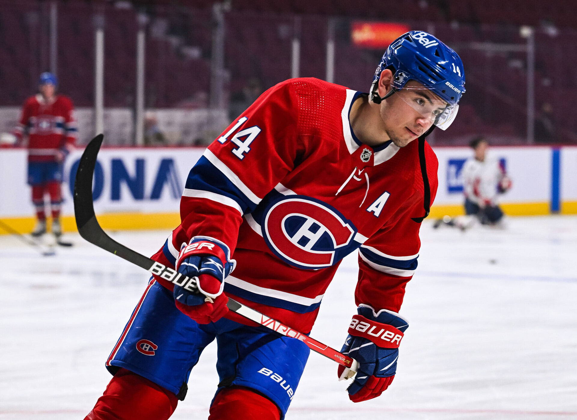Montreal Canadiens center Nick Suzuki skates during warm-ups before a game