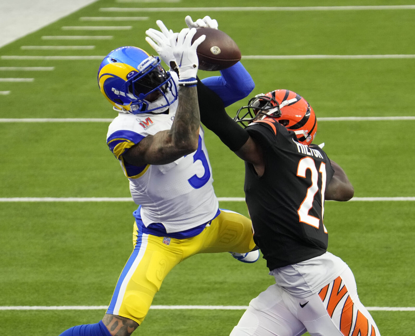 Feb 13, 2022; Inglewood, CA, USA; Los Angeles Rams wide receiver Odell Beckham Jr. (3) catches a touchdown pass over Cincinnati Bengals cornerback Mike Hilton (21) during the first quarter in Super Bowl LVI at SoFi Stadium.