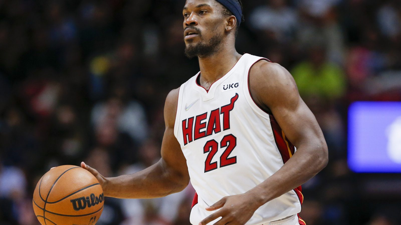Miami Heat forward Jimmy Butler dribbles the basketball in a game against the Dallas Mavericks