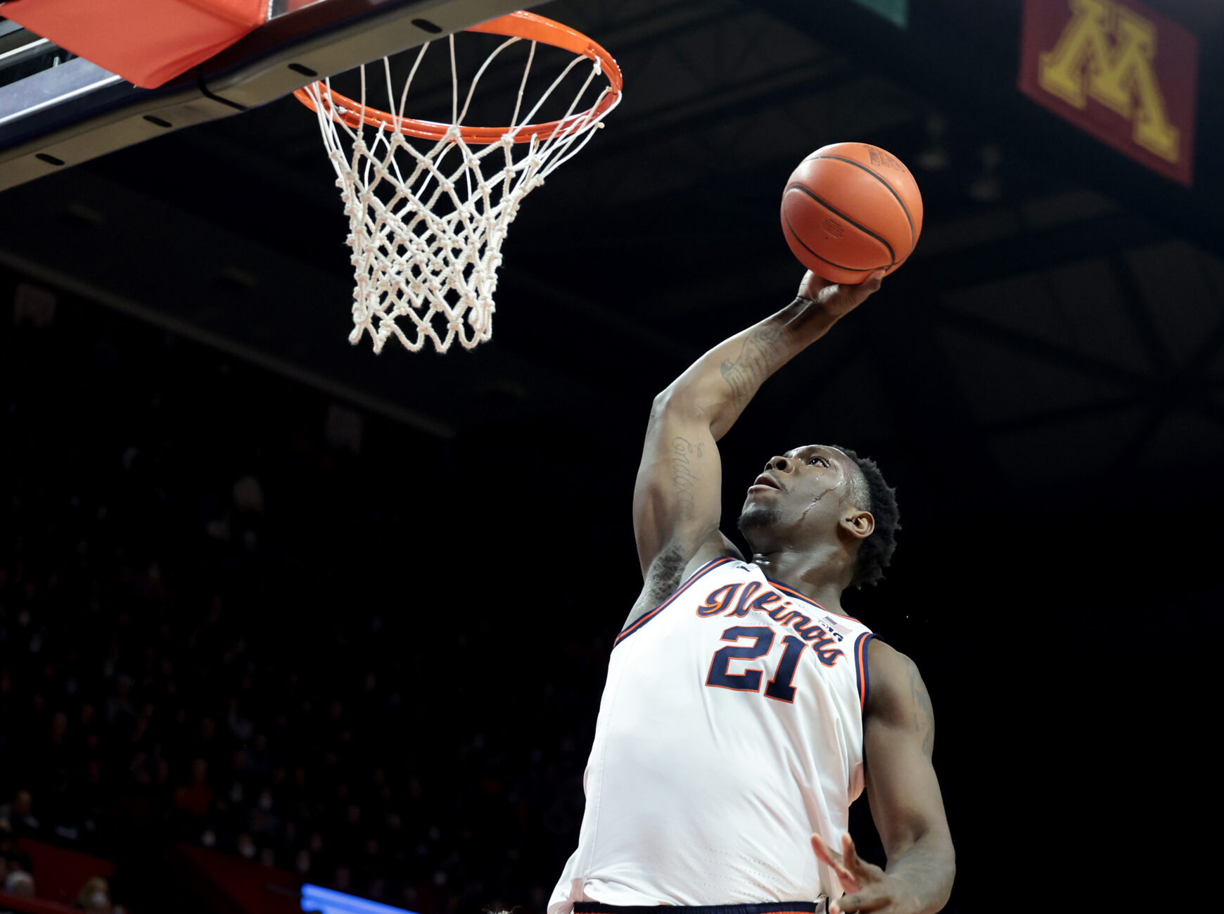 Illinois Fighting Illini center Kofi Cockburn prepares to dunk the basketball during a Big Ten game against the Rutgers Scarlet Knights