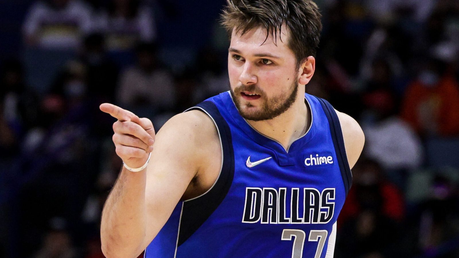 Dallas Mavericks guard Luka Doncic points toward a teammate as he reacts to a play against the New Orleans Pelicans