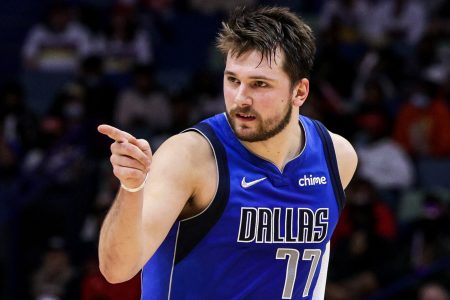 Dallas Mavericks guard Luka Doncic points toward a teammate as he reacts to a play against the New Orleans Pelicans
