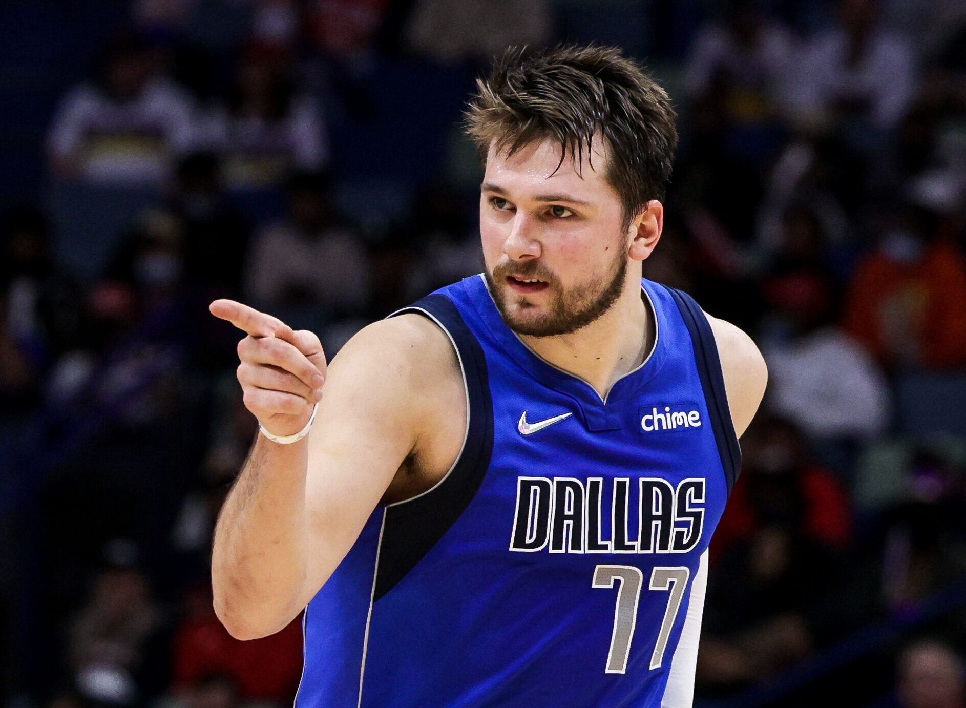 Dallas Mavericks guard Luka Doncic points toward a teammate as he reacts to a play against the New Orleans Pelicans