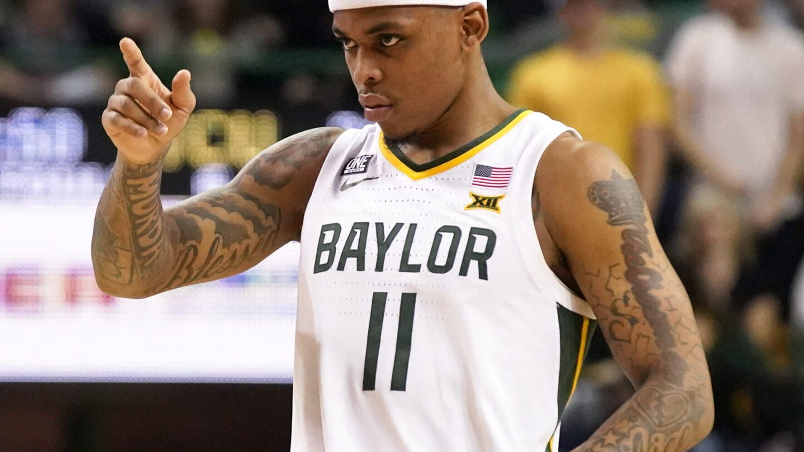 Baylor Bears guard James Akinjo points to the basket after a made free thrown during a Big 12 basketball game against the TCU Horned Frogs
