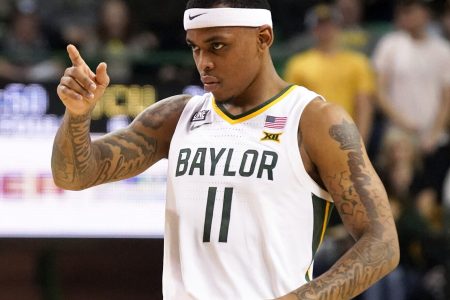 Baylor Bears guard James Akinjo points to the basket after a made free thrown during a Big 12 basketball game against the TCU Horned Frogs