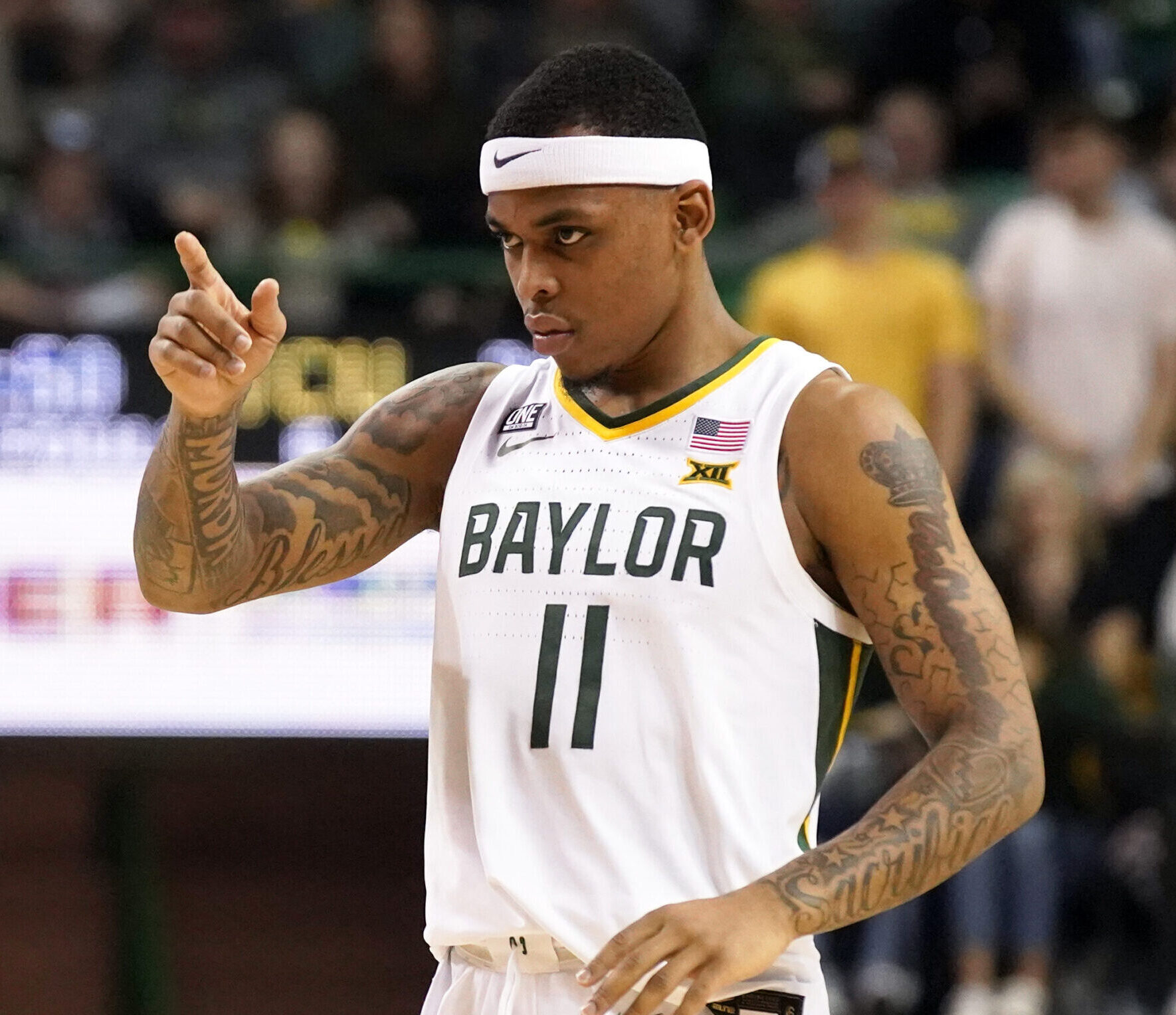 Baylor Bears guard James Akinjo points to the basket after a made free thrown during a Big 12 basketball game against the TCU Horned Frogs