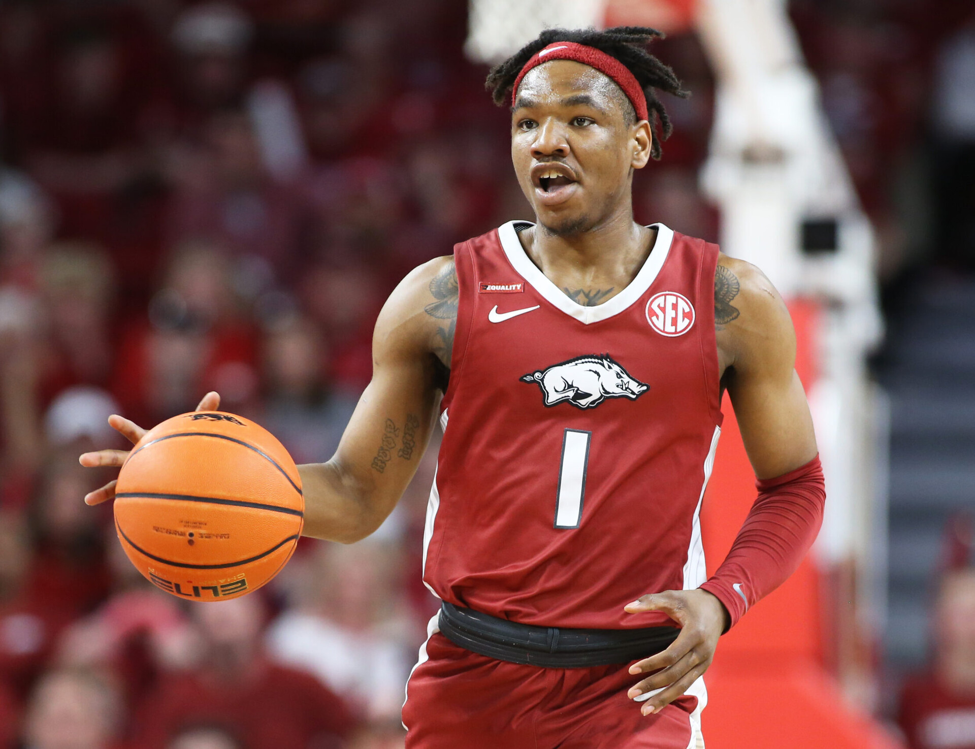 Arkansas Razorbacks guard JD Notae dribbles the ball upcourt against the Tennessee Volunteers during an SEC basketball game