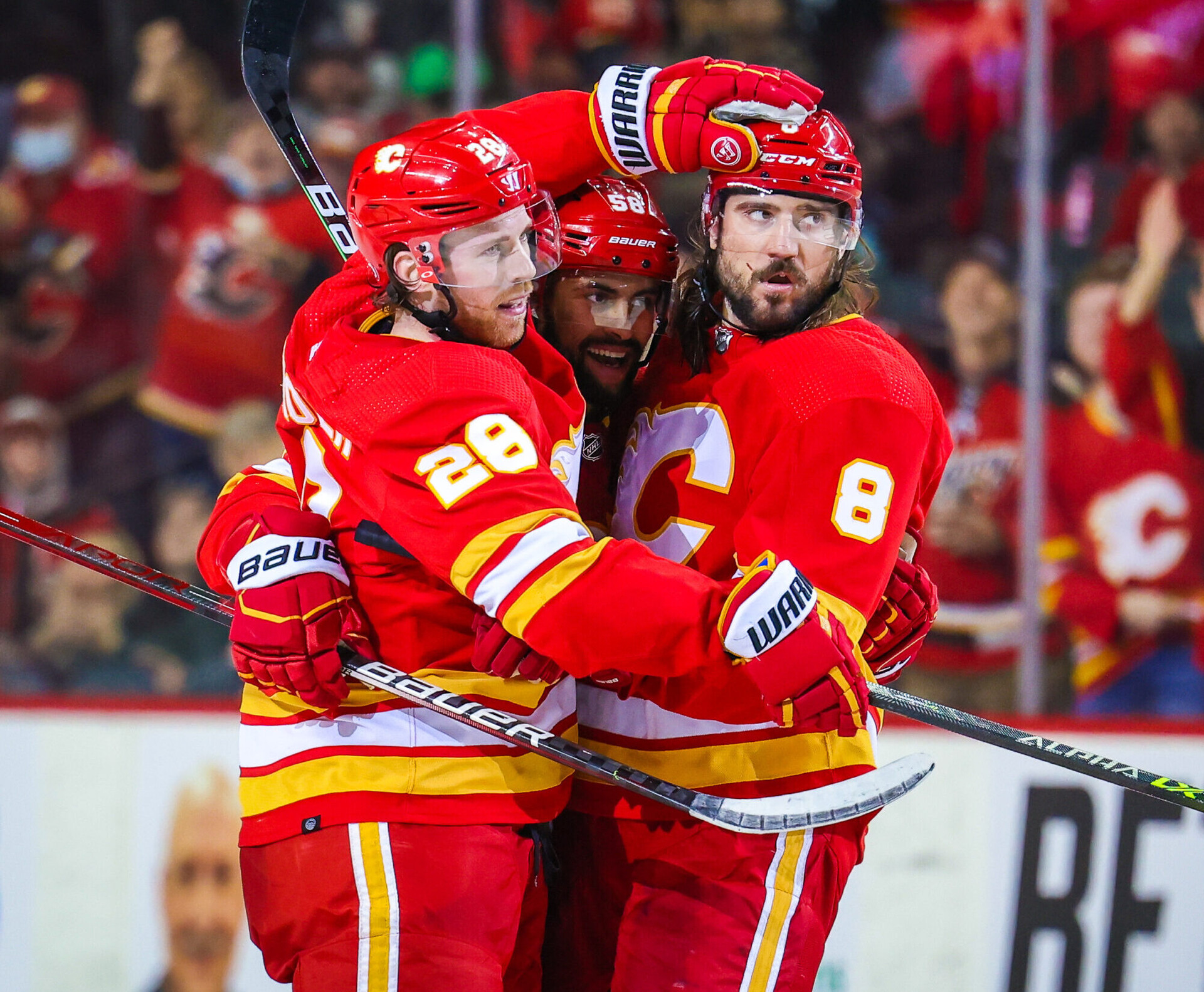 Calgary Flames center Elias Lindholm (28) celebrates his goal with teammates against the Seattle Kraken